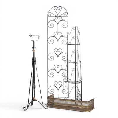 Lot 625 - A wrought iron torchere, 137cm high, together...