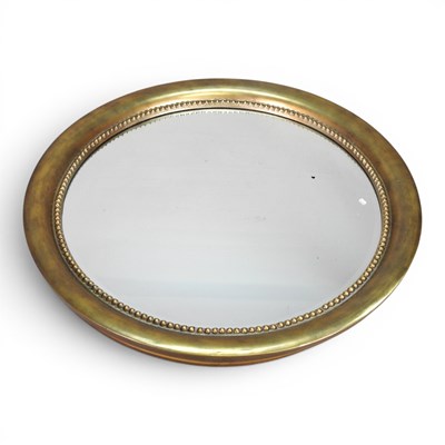 Lot 513 - A large gilt metal framed wall mirror, on...
