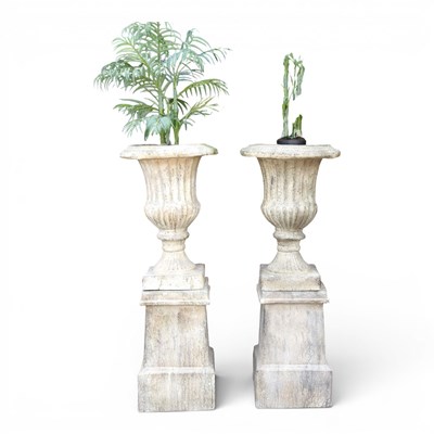 Lot 50 - A pair of large stone effect garden urns, each...