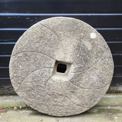 Lot 92 - A cast stone mill stone