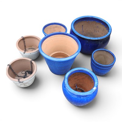 Lot 512 - A collection of five blue glazed garden pots,...