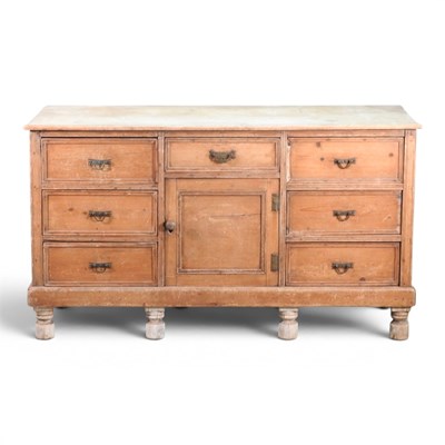 Lot 543 - An antique pine dresser base, on turned feet