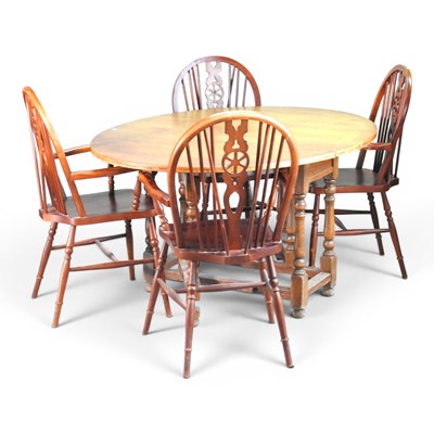 Lot 549 - A mid 20th century drop leaf dining table,...